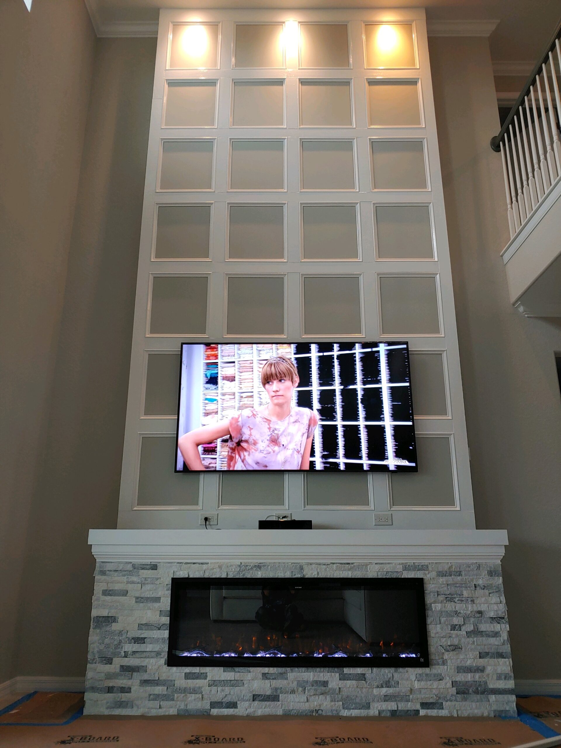 2-story media wall, wainscoting, ledgerstone, mantle