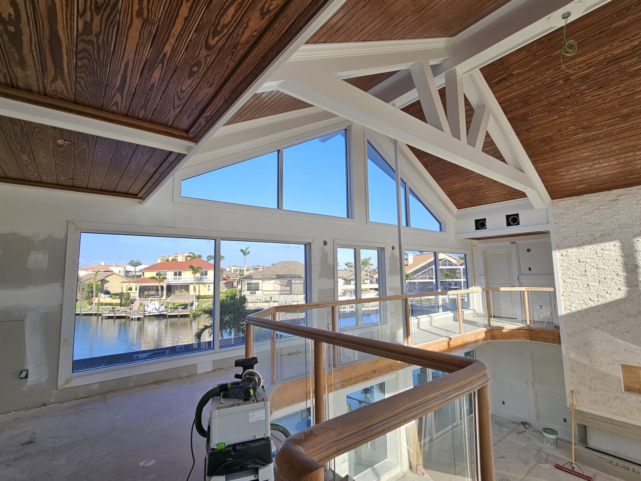Jan, southwest cape coral, tongue and groove ceiling, wood beams, ledgerstone, media wall, wainscoting